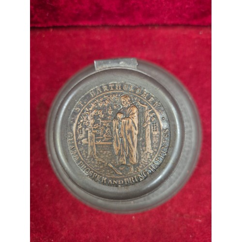 99 - An unusual early 20th Century Pewter Inkwell, the lid set with a brass plaque of St Bartholomew with... 