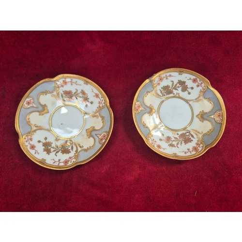 120 - A pair of pretty antique coffee cans and saucers, with hand painted floral and gilt decoration, the ... 