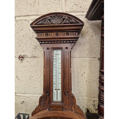 105 - Victorian solid oak banjo wall barometer carved with foliate details, with porcelain dial, brass bez... 