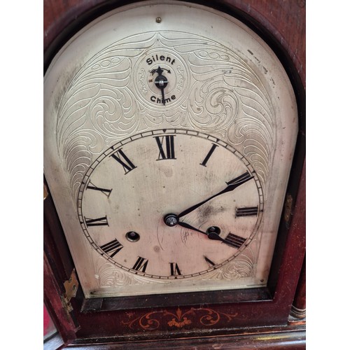 108 - Edwardian mahogany cased mantel clock with domed top, turned columns and scrolling boxwood inlay. En... 
