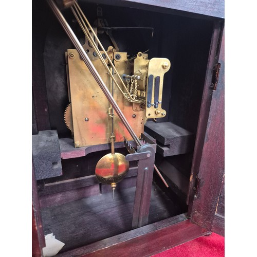 108 - Edwardian mahogany cased mantel clock with domed top, turned columns and scrolling boxwood inlay. En... 