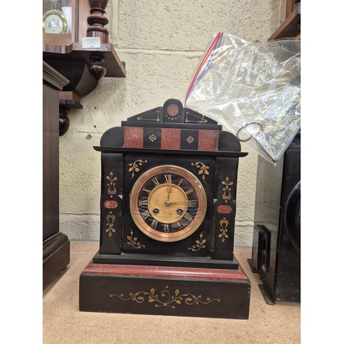 109 - Victorian black slate and marble mantel clock, with gilded engraved floral details, brass bezel and ... 