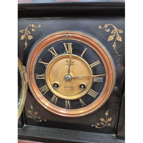 109 - Victorian black slate and marble mantel clock, with gilded engraved floral details, brass bezel and ... 