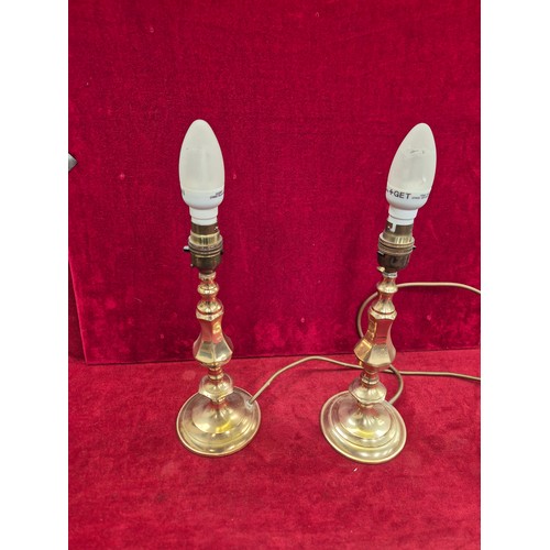 114 - Pair of brass candlesticks converted to table lamps (wired to one plug).