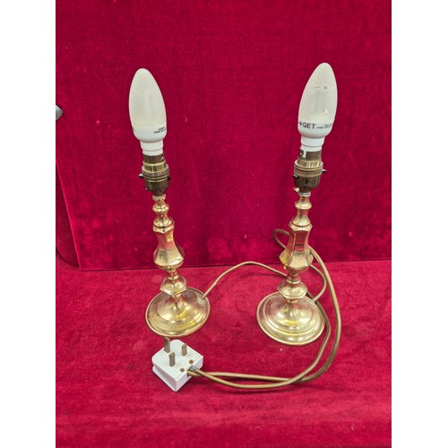 114 - Pair of brass candlesticks converted to table lamps (wired to one plug).