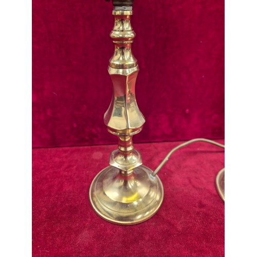 114 - Pair of brass candlesticks converted to table lamps (wired to one plug).