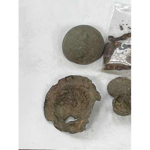36 - A small collection of metal detector finds, including a hook, buttons, studs, knapped flint etc.