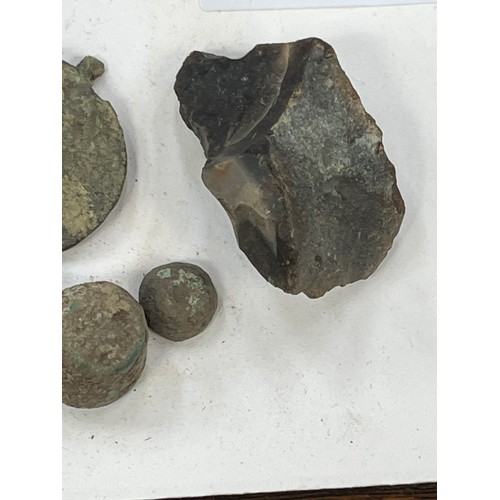 36 - A small collection of metal detector finds, including a hook, buttons, studs, knapped flint etc.