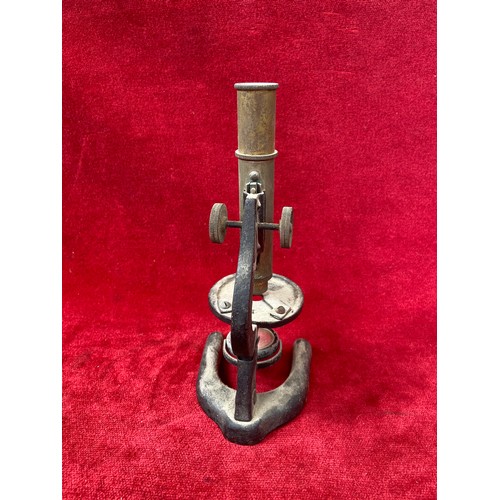 57 - Small antique 'Octopus' series brass and cast metal microscope (needs attention).