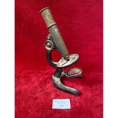 57 - Small antique 'Octopus' series brass and cast metal microscope (needs attention).