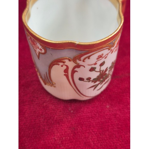 237 - A pair of pretty antique coffee cans and saucers, with hand painted floral and gilt decoration, the ... 