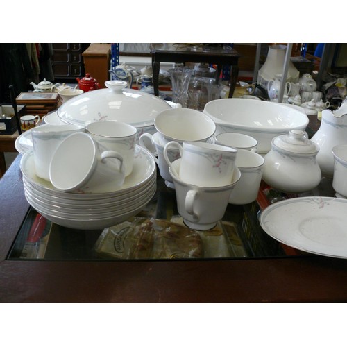 166 - A very large dinner service by Royal Doulton in the 'Carnation' pattern to include dinner plates, sa... 