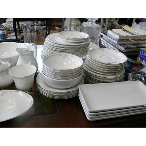 166 - A very large dinner service by Royal Doulton in the 'Carnation' pattern to include dinner plates, sa... 