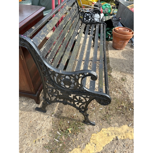 388 - VICTORIAN STYLE GARDEN BENCH WITH CAST METAL ENDS AND TWO SUPPORTING STRAPS -CLASSIC DESIGN WITH LIO... 