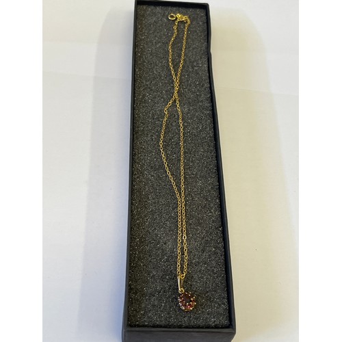10 - a 9ct gold 16 inch chain with 9ct gold pendant including garnets weight 2.41 gr