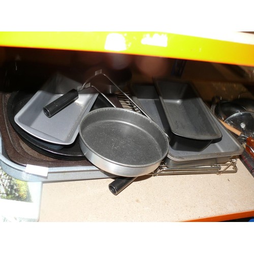 313 - Shelf of oven dishes and chopping boards to include 1 with a train