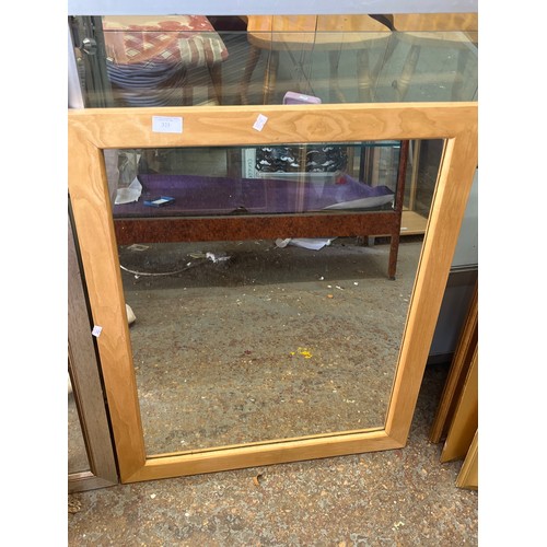 323 - Light wood framed wall mirror