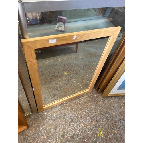 323 - Light wood framed wall mirror