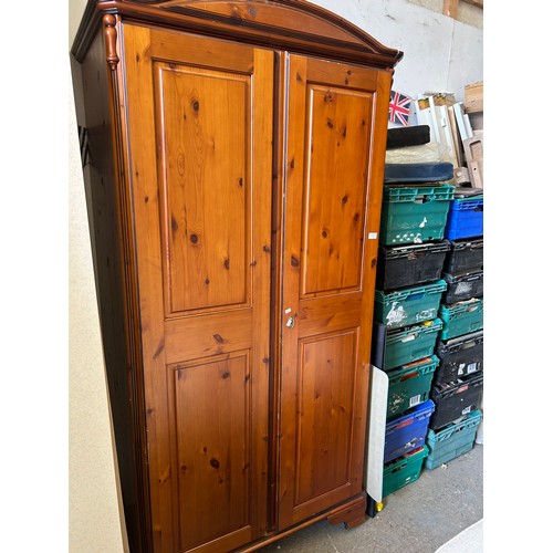 333 - Pine panelled wardrobe with arched top