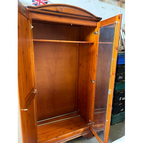 333 - Pine panelled wardrobe with arched top