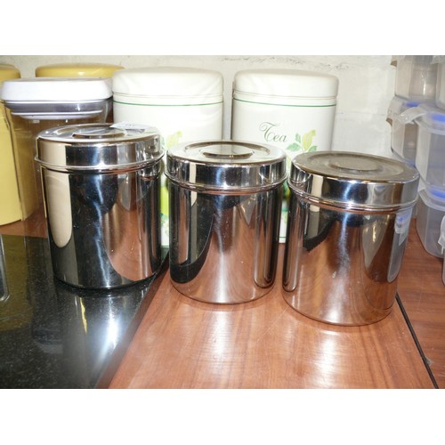 151 - Black Granite worktop saver with a large collection of storage cannisters