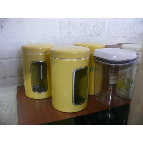 151 - Black Granite worktop saver with a large collection of storage cannisters