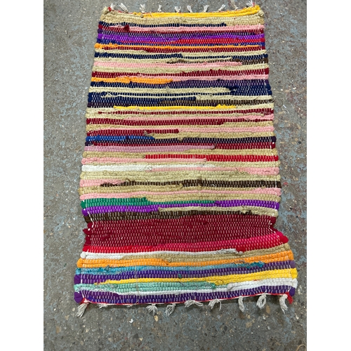 Brightly coloured hand made rag rug