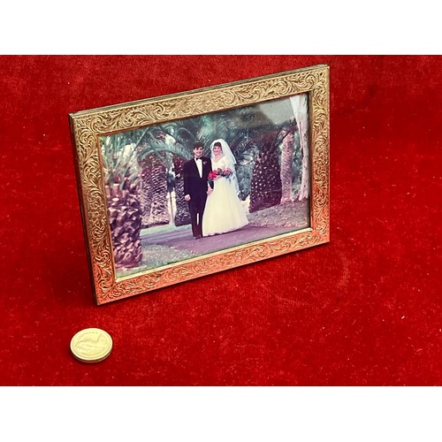 10 - Small 925 silver photograph frame, chased with classical scrolls and London import hallmarks on the ... 