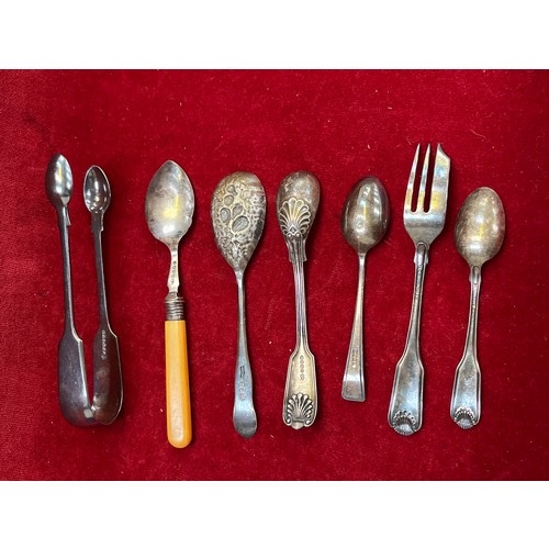 12 - Collection of silver plated flatware, including a berry spoon, sugar nip tongs, teaspoons etc.
