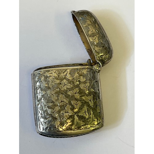 16 - Victorian sterling silver vesta case, chased and engraved on both sides with three leaf decoration, ... 
