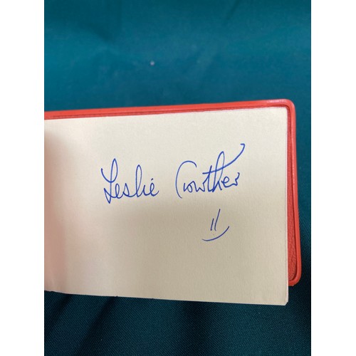 19 - Small vintage autograph book with a variety of signatures, most notably including Leslie Crowther, a... 