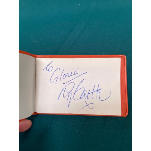19 - Small vintage autograph book with a variety of signatures, most notably including Leslie Crowther, a... 