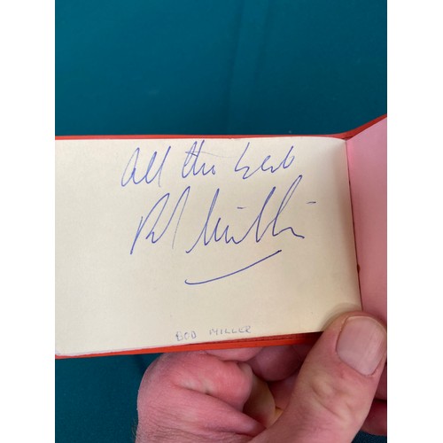 19 - Small vintage autograph book with a variety of signatures, most notably including Leslie Crowther, a... 