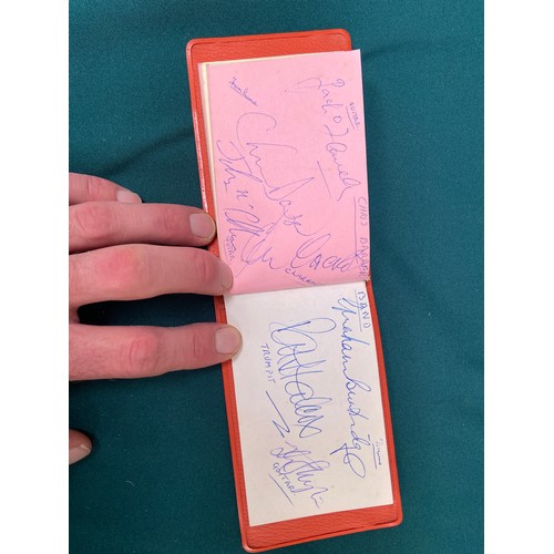 19 - Small vintage autograph book with a variety of signatures, most notably including Leslie Crowther, a... 