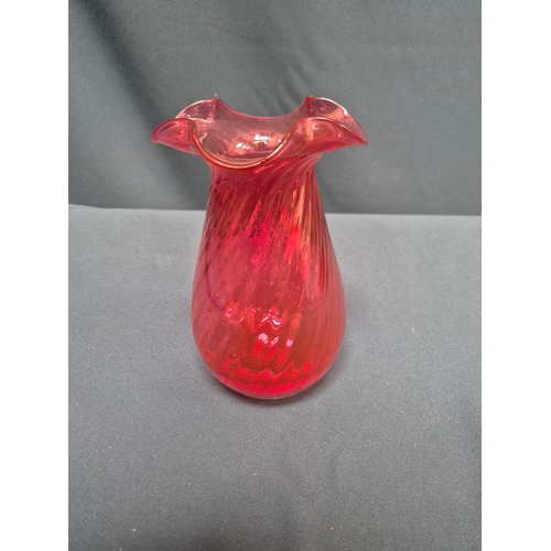27 - Cranberry glass vase with frilled rim and swirl design by Dartington Crystal 20cm high
