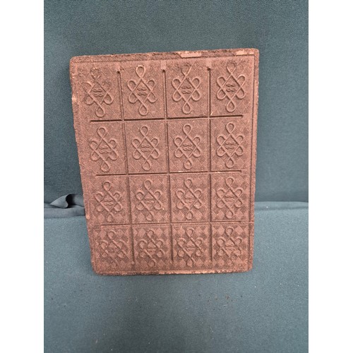 34 - An unusual Antique Chinese tea block made from compressed black tea. Pressed with a design of a temp... 