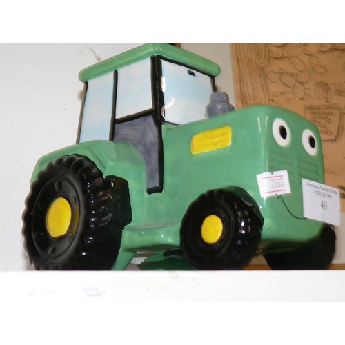 49 - CERAMIC TRACTOR MONEY BOX (JOHN DEERE) AND A CARVED WOODEN COW MONEY BOX.