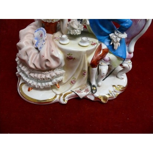 52 - ARTMARK PORCELAIN STATUE OF A EUROPEAN COUPLE HAVING TEA AT TABLE.