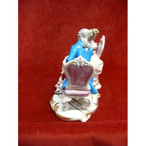 52 - ARTMARK PORCELAIN STATUE OF A EUROPEAN COUPLE HAVING TEA AT TABLE.
