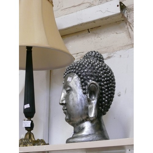 42 - SILVER COLOURED BUDDHA HEAD SCULPTURE.