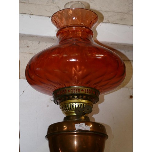 46 - ANTIQUE COPPER AND BRASS DUPLEX OIL LAMP, WITH ROSE COLOURED SHADE AND GLASS CHIMNEY.
