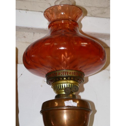 46 - ANTIQUE COPPER AND BRASS DUPLEX OIL LAMP, WITH ROSE COLOURED SHADE AND GLASS CHIMNEY.