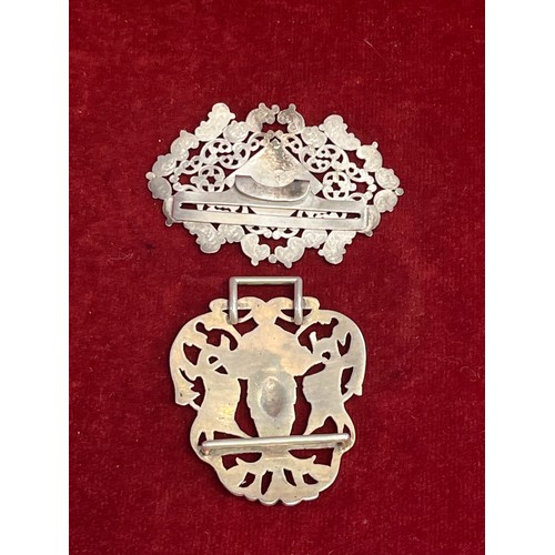 17 - Two sterling silver nurses buckles one with pierced mask and bird design, Birm 1891, Deakin & Franci... 