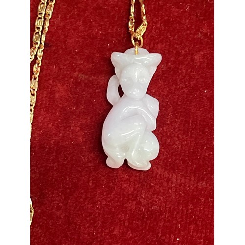 27 - White jade monkey pendant on a gold coloured (untested) chain - 70cm