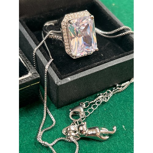 44 - Two sterling silver rings with large square cut pale blue crystal stones - size R together with a 92... 