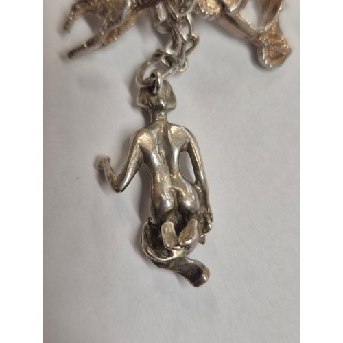 49 - Vintage silver charm bracelet with 14 charms - various marks inc 
