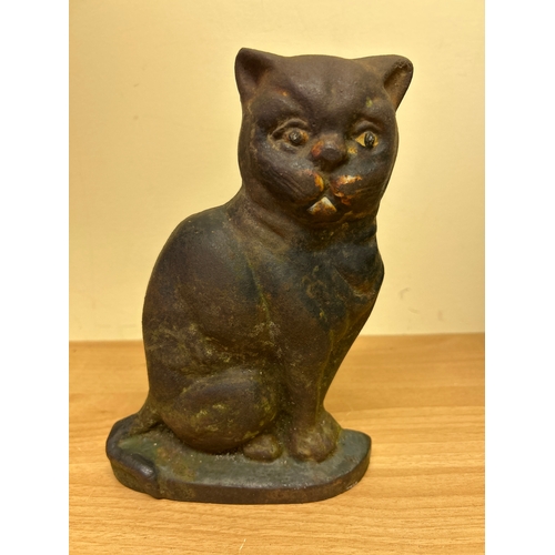 1 - An Antique Cast Iron cat door stop, with traces of original paint to the face. 22cm h