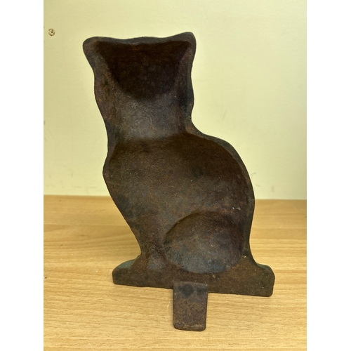1 - An Antique Cast Iron cat door stop, with traces of original paint to the face. 22cm h