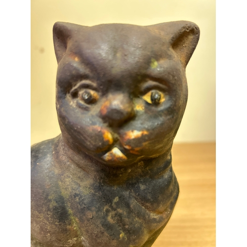 1 - An Antique Cast Iron cat door stop, with traces of original paint to the face. 22cm h