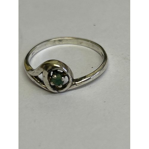 44 - Two vintage sterling silver rings, one in crossover style with 3 garnet stones hallmarked Sheffield ... 